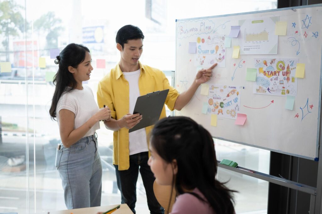 Startup founders planning capital efficient business growth instead of aggressive fundraising