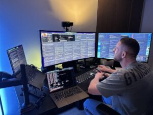 Solo founder building an AI-powered Micro-SaaS business from a modern workspace
