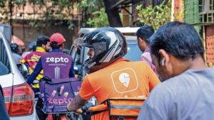 Blinkit and Zepto dark stores with delivery riders illustrating the logistics infrastructure behind quick commerce in India.