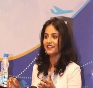 Akanksha Anshu, founder and managing director of Refundme.in, speaking at a travel and aviation industry event.