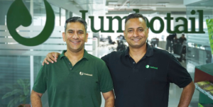 Ashish Jhina and S. Karthik Venkateswaran, co-founders of Jumbotail, standing at the company's office, India's leading B2B grocery and FMCG marketplace.