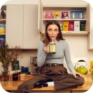 Emma Chamberlain promoting Chamberlain Coffee, the creator-founded coffee brand that expanded into more than 8,500 retail stores across North America.