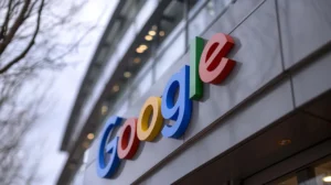 Google logo displayed on the exterior of a modern office building, representing the company's expanding artificial intelligence and technology ecosystem.