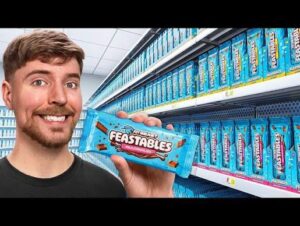 MrBeast holding a Feastables chocolate bar inside a retail store, showcasing the brand's expansion across Walmart and other major retailers in North America.