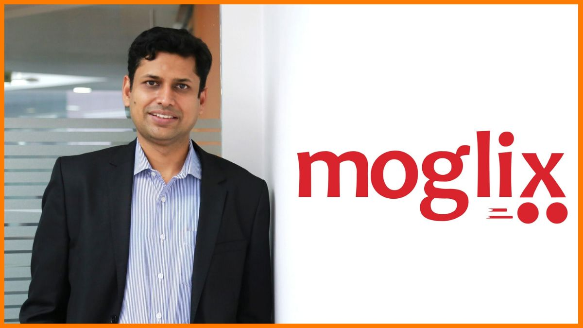 Rahul Garg, founder and CEO of Moglix, standing beside the Moglix logo at the company's office in India.