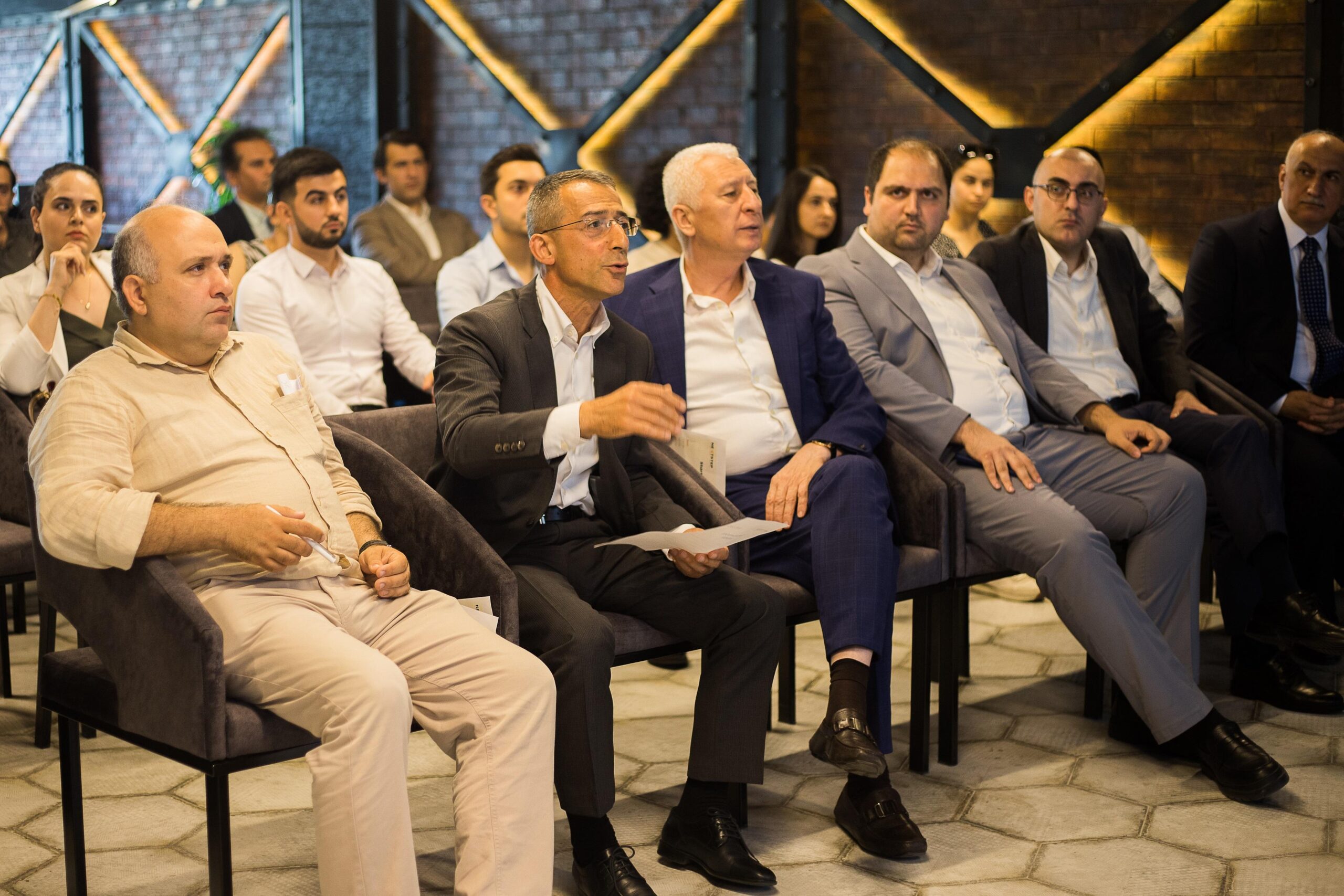 Startup founder pitching investors during a venture capital fundraising meeting.