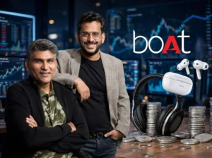 boAt founders with headphones and wireless earbuds, representing the Indian consumer electronics and audio brand.