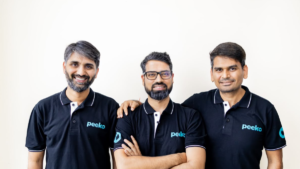 Peeko founders posing together in branded Peeko shirts.